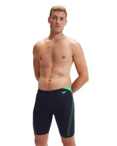 Man with his hands behind back wearing Speedo HyperBoom Splice Jammer - Navy / Green Man with his hands behind back wearing Speedo HyperBoom Splice Jammer - Navy / Green