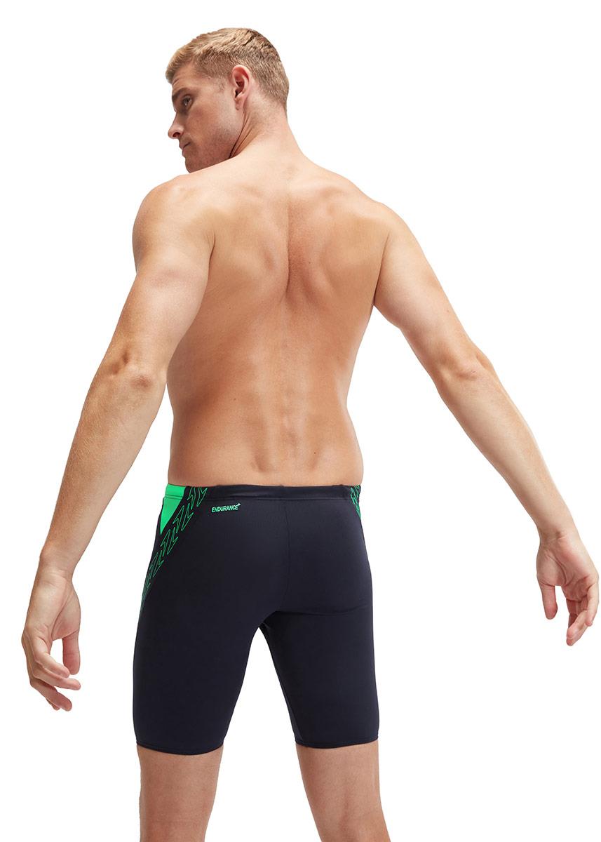 Man with his hands behind back wearing Speedo HyperBoom Splice Jammer - Navy / Green