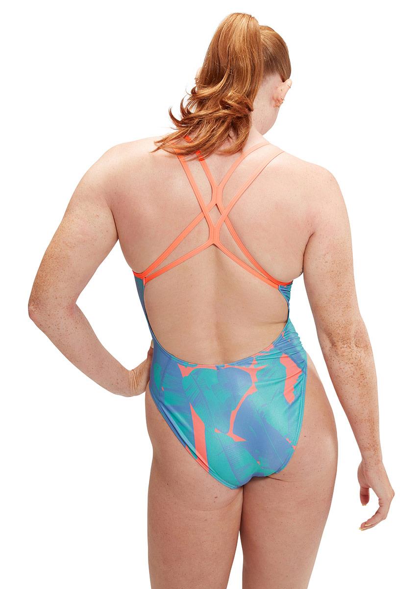 Woman with hands on hips wearing Speedo Allover Digital Starback Banana Leaf Swimsuit - Blue / Pink